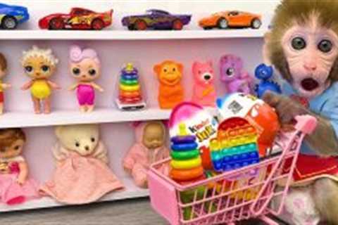 Monkey Baby Bon Bon doing shopping in Car Toy store and eat Kinder Joy Egg chocolate with puppy